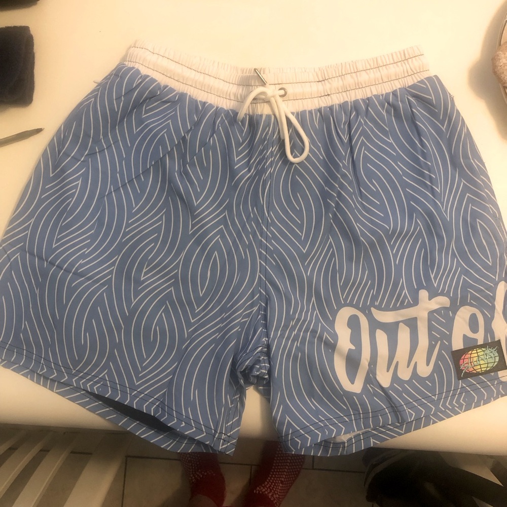 Slunk Shorts.  Brand New. Never Worn.
Out of System Logo